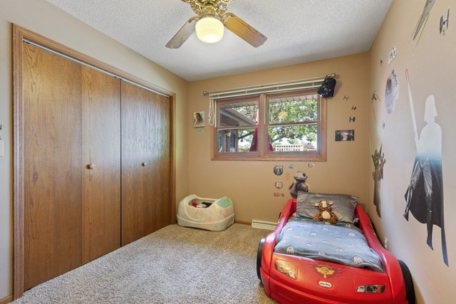 728 Schoolgate Road New Lenox, IL 60451 - Photo 13 of 24 a bedroom with bed and a window