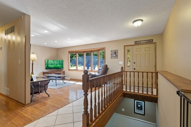 728 Schoolgate Road New Lenox, IL 60451 - Photo 3 of 24 a view of a livingroom with furniture and garden view
