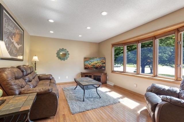 728 Schoolgate Road New Lenox, IL 60451 - Photo 4 of 24 a living room with furniture and a large window