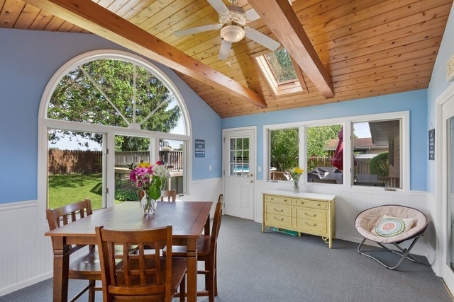 728 Schoolgate Road New Lenox, IL 60451 - Photo 9 of 24 a dining room with furniture a livingroom view and a large window