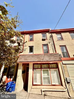a bed room with bed and a flat screen tv