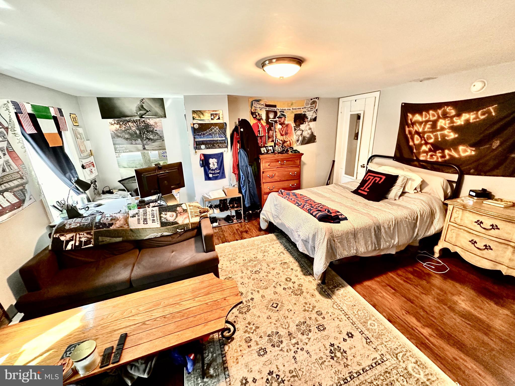 3652 Midvale Avenue, Unit 3 Philadelphia, PA 19129 - Photo 3 of 9 a bedroom with bed and a flat screen tv