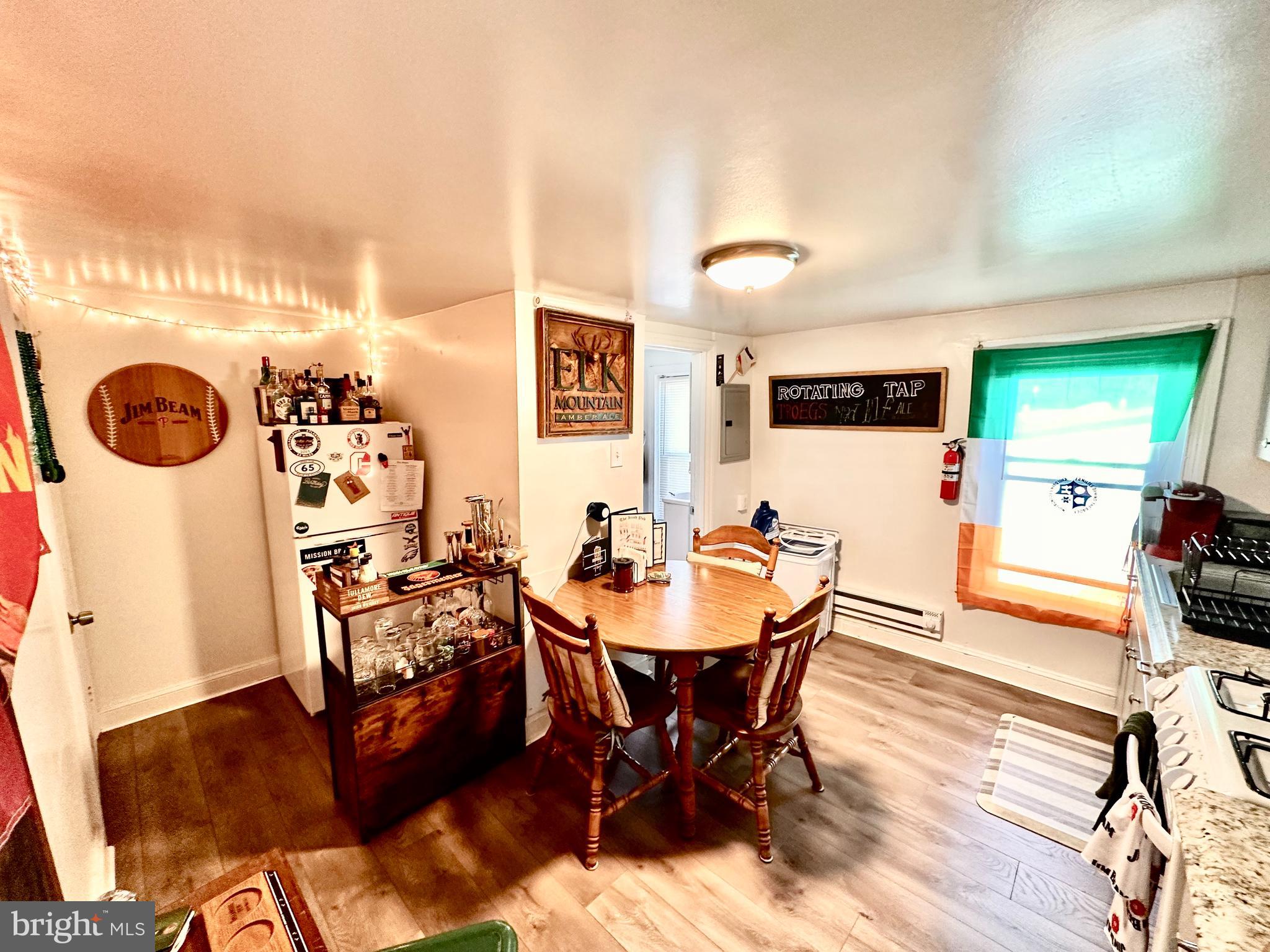 3652 Midvale Avenue, Unit 3 Philadelphia, PA 19129 - Photo 7 of 9 a view of a dining room with furniture and wooden floor