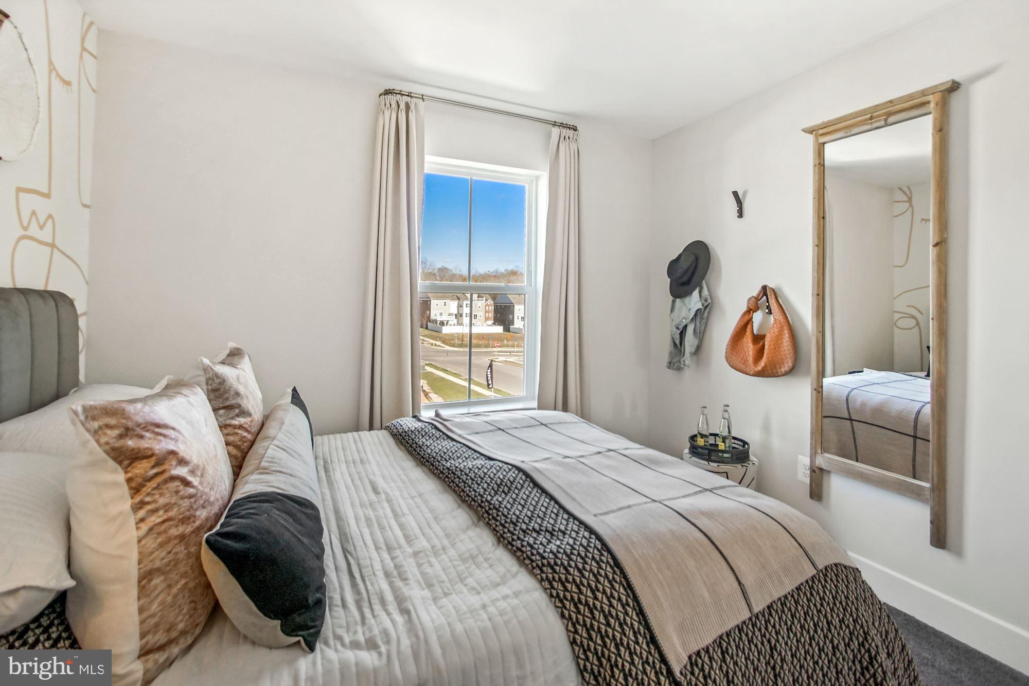4151 Skipton Place White Plains, MD 20695 - Photo 17 of 27 a bedroom with a bed and a window