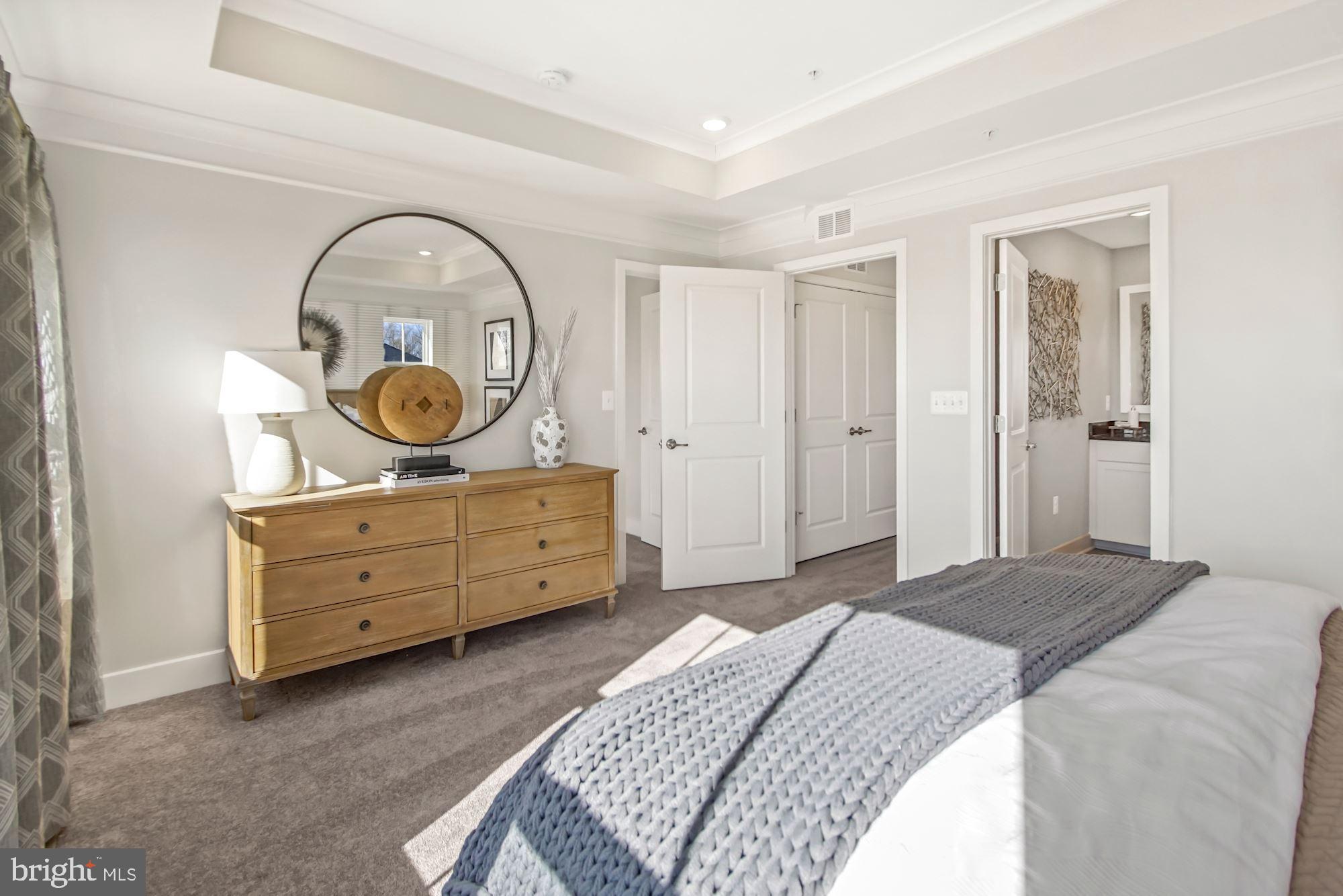 4151 Skipton Place White Plains, MD 20695 - Photo 21 of 27 a bedroom with a bed and cabinets