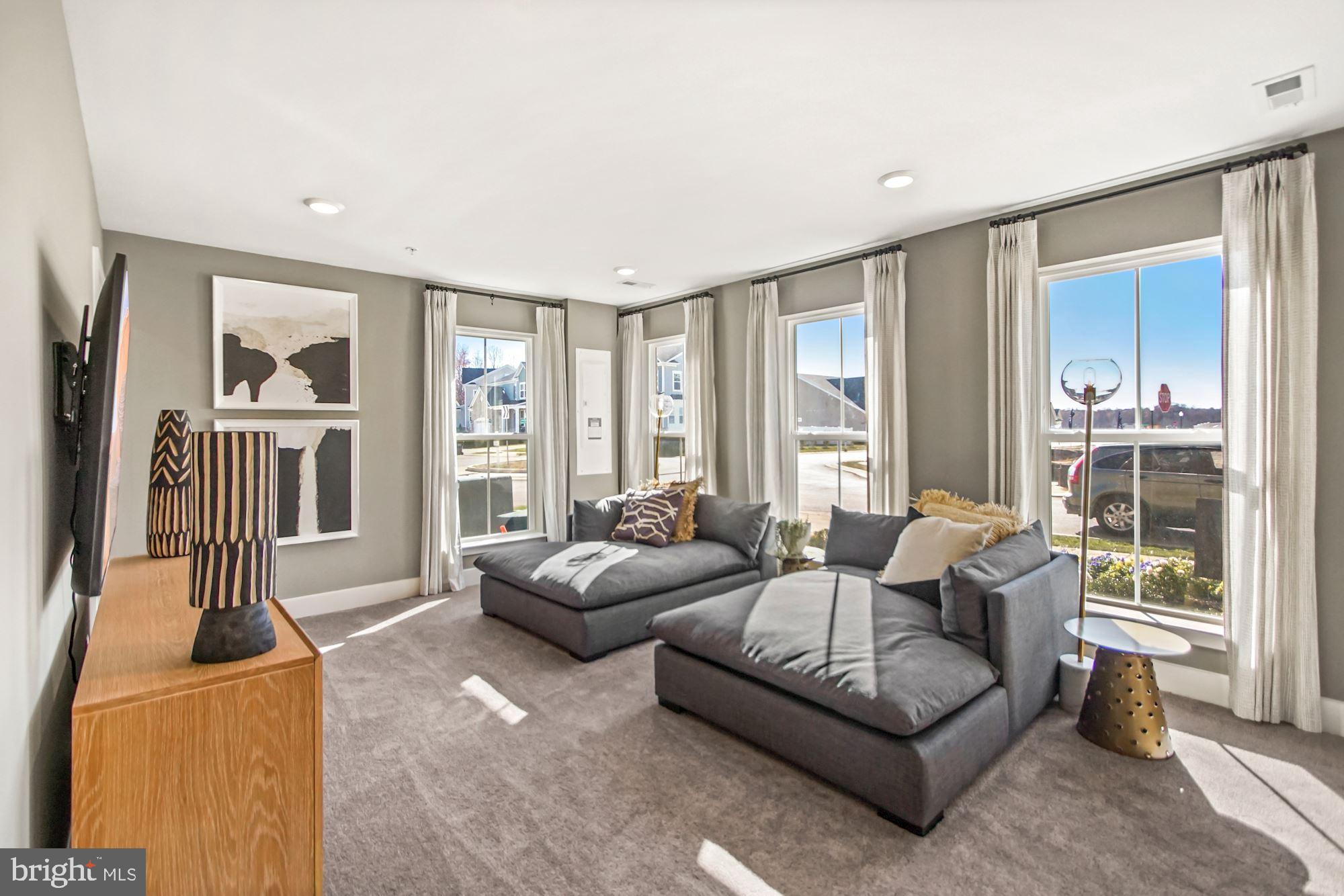 4151 Skipton Place White Plains, MD 20695 - Photo 6 of 27 a living room with furniture and a large window