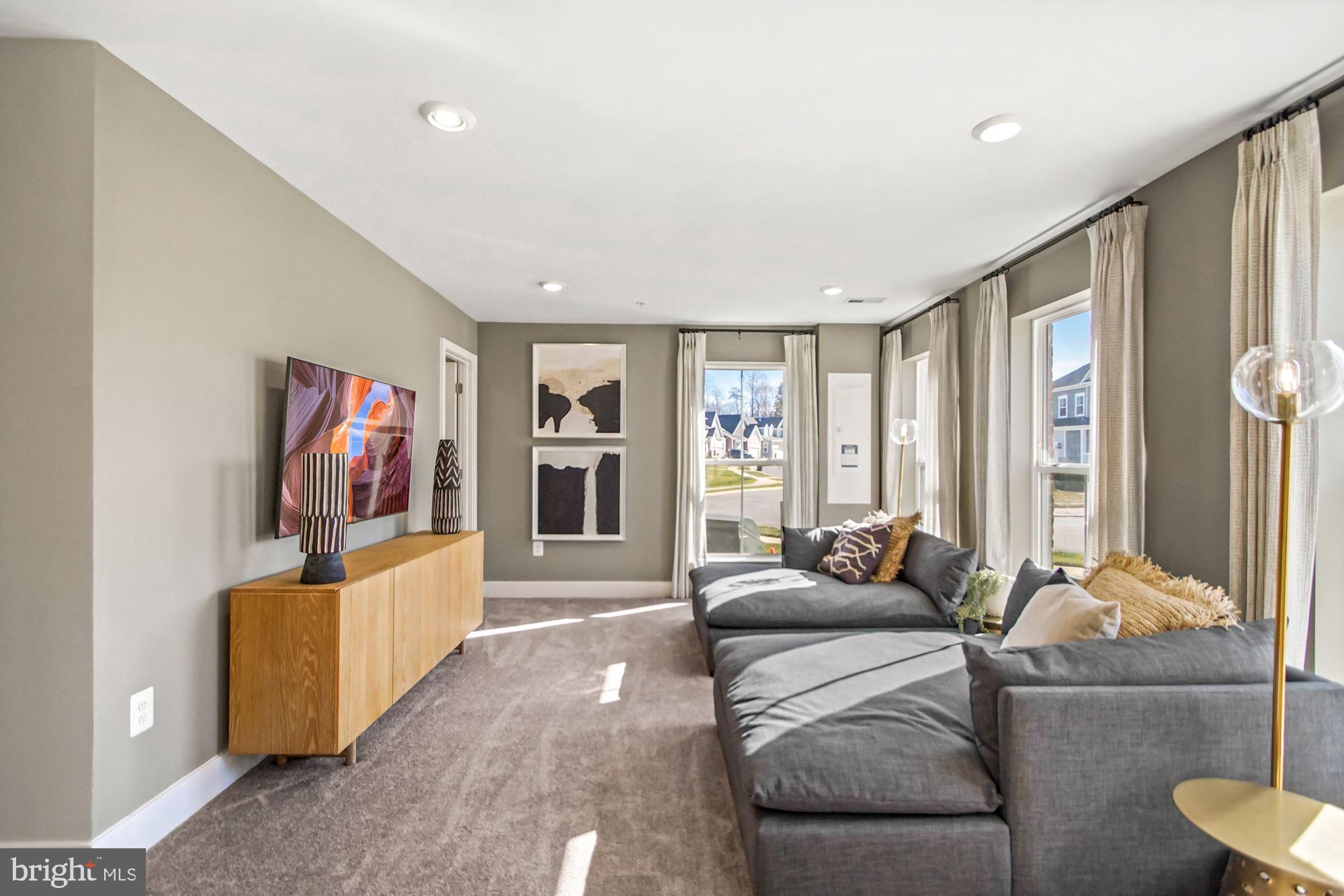 4151 Skipton Place White Plains, MD 20695 - Photo 7 of 27 a living room with furniture and a flat screen tv