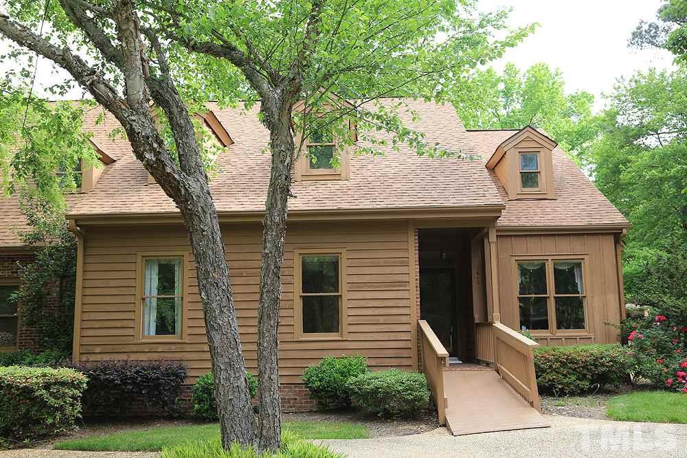 7610 Wilderness Road Raleigh, NC 27613 - Photo 1 of 27 a view of a house with a yard and plants