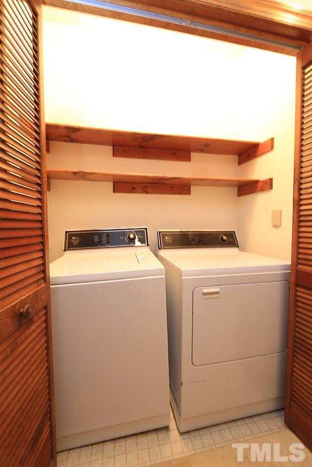 7610 Wilderness Road Raleigh, NC 27613 - Photo 10 of 27 a utility room with dryer and washer