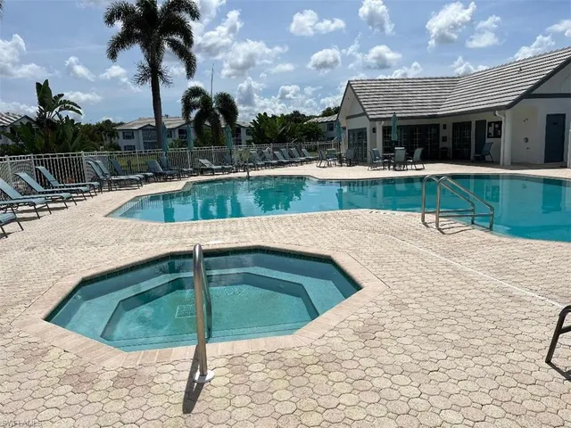 a view of a swimming pool with a patio