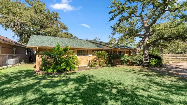 a kitchen with refrigerator and cabinets
