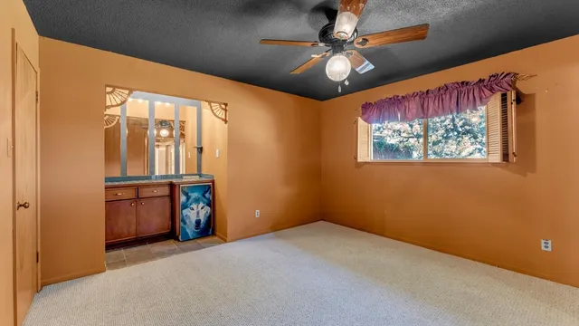 a view of storage and utility room with a window