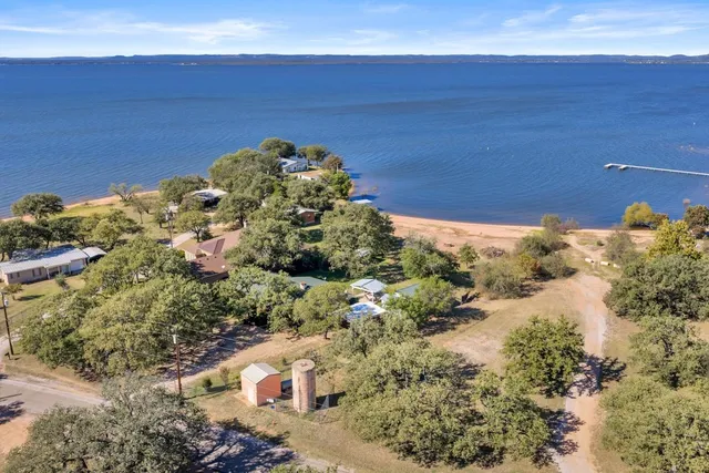 a view of a house with a yard porch and sitting area