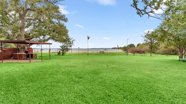 a view of a house with a yard porch and sitting area