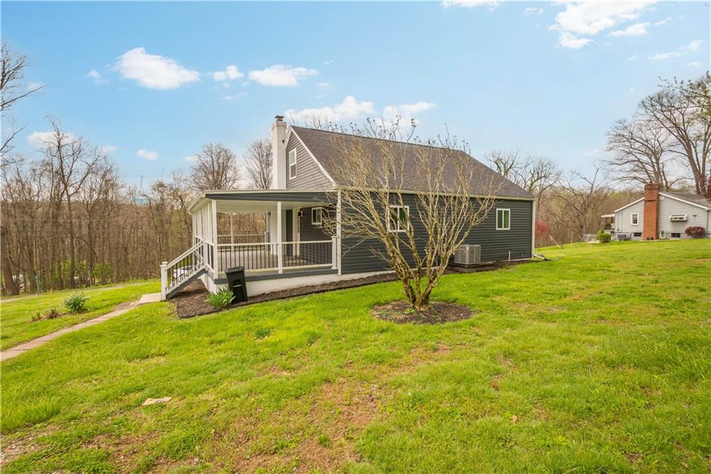 30 Evans Road Charleroi, PA 15022 - Photo 29 of 32 a view of a house with a big yard and potted plants