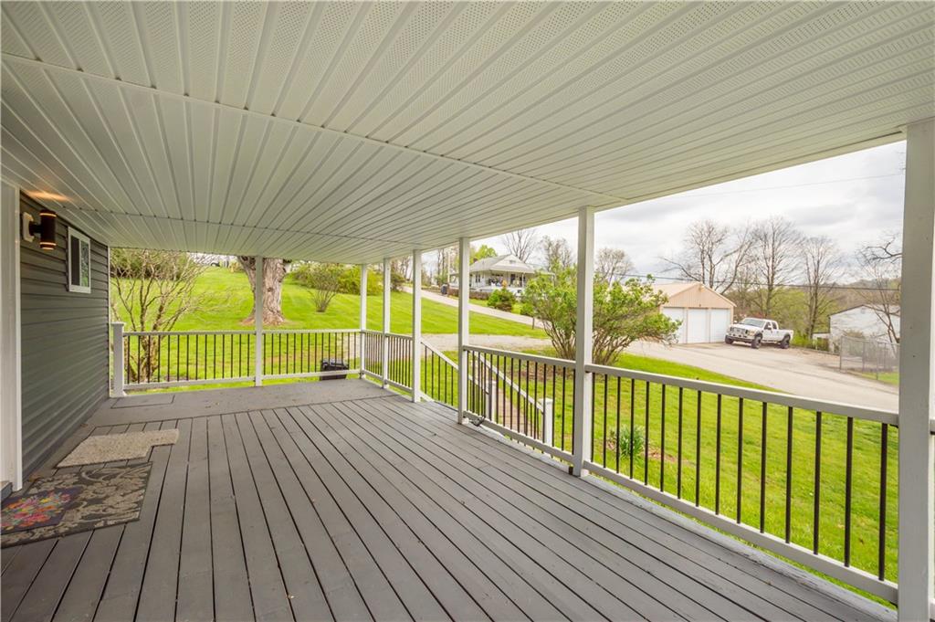 30 Evans Road Charleroi, PA 15022 - Photo 4 of 32 a view of deck with a floor to ceiling window with wooden floor