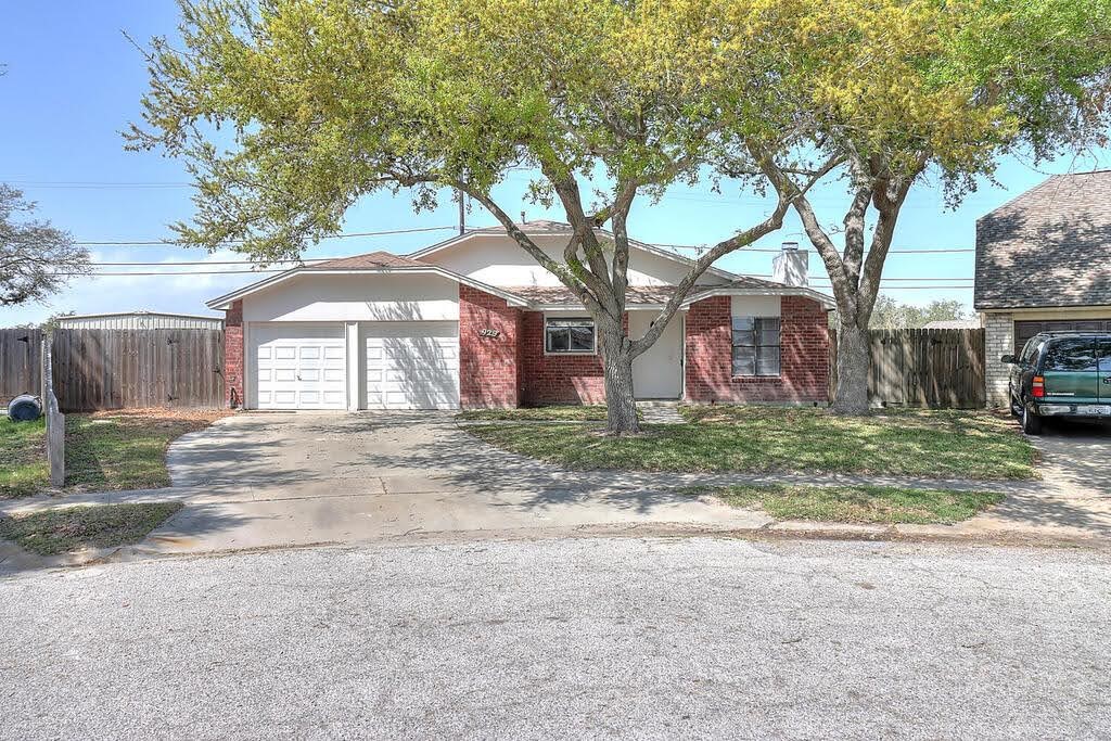 929 St Timothy Street Corpus Christi, TX 78418 - Photo 1 of 35 a front view of a house with a yard and garage