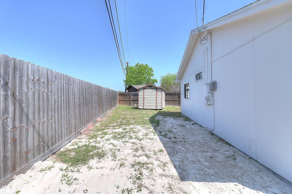 929 St Timothy Street Corpus Christi, TX 78418 - Photo 26 of 35 a view of a backyard with pathway