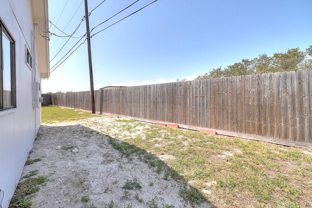 929 St Timothy Street Corpus Christi, TX 78418 - Photo 27 of 35 a view of a backyard with wooden fence
