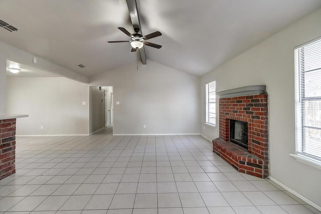929 St Timothy Street Corpus Christi, TX 78418 - Photo 3 of 35 a view of an empty room with a fireplace and a window