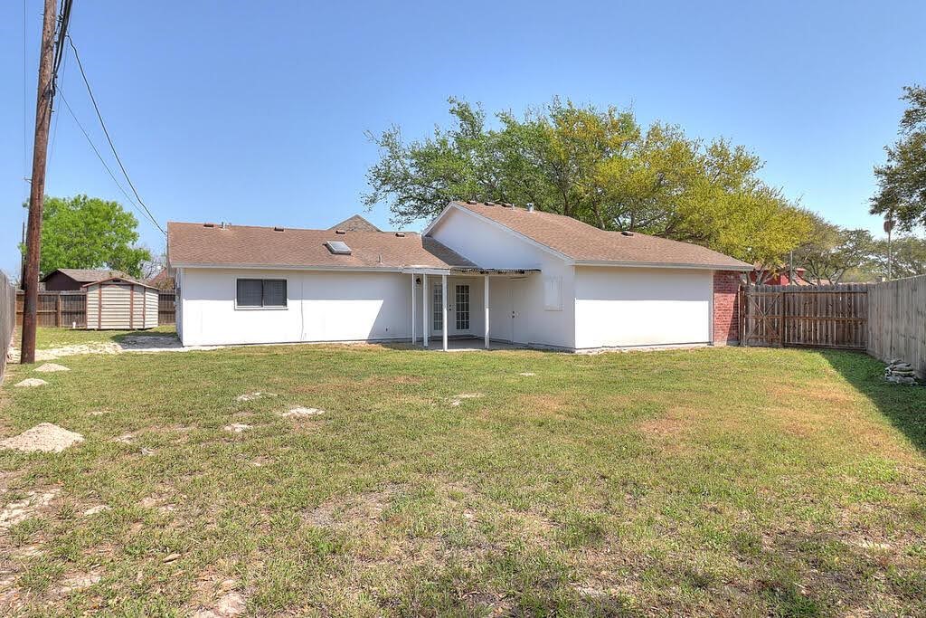 929 St Timothy Street Corpus Christi, TX 78418 - Photo 31 of 35 a front view of a house with a garden
