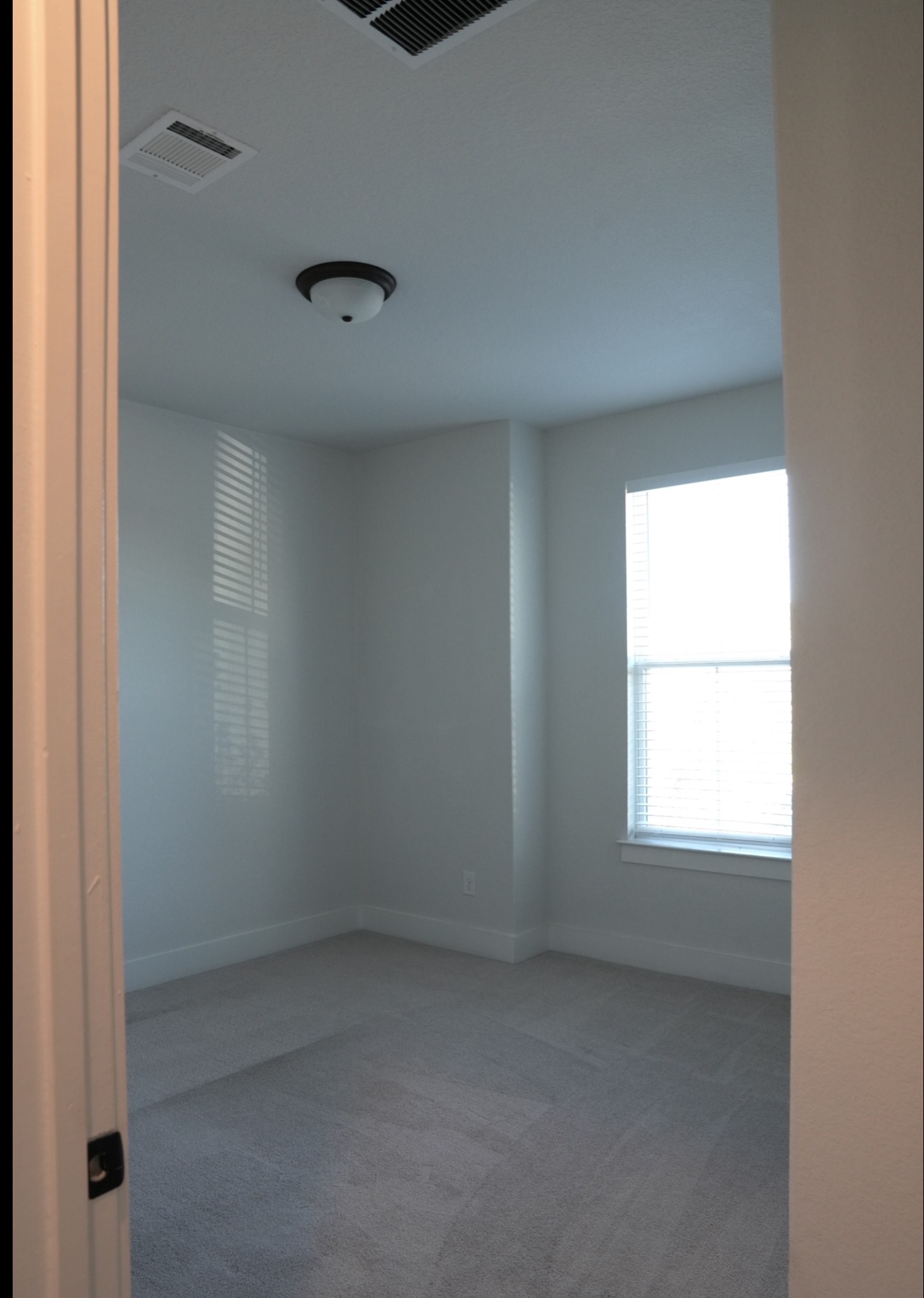 3812 Mercer Road Georgetown, TX 78628 - Photo 11 of 33 Spare room featuring light carpet and baseboards