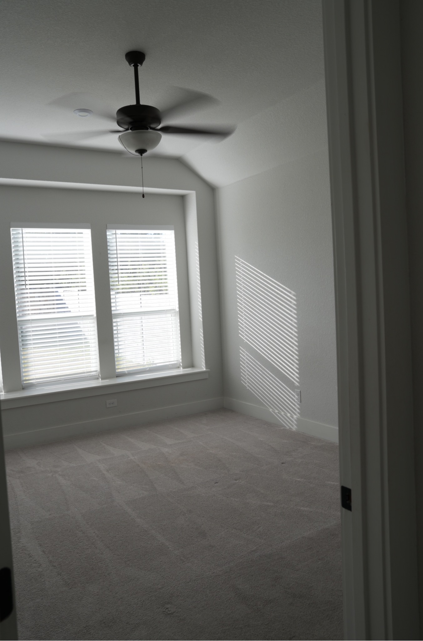 3812 Mercer Road Georgetown, TX 78628 - Photo 13 of 33 Bedroom featuring dark carpet, lofted ceiling, and ceiling fan