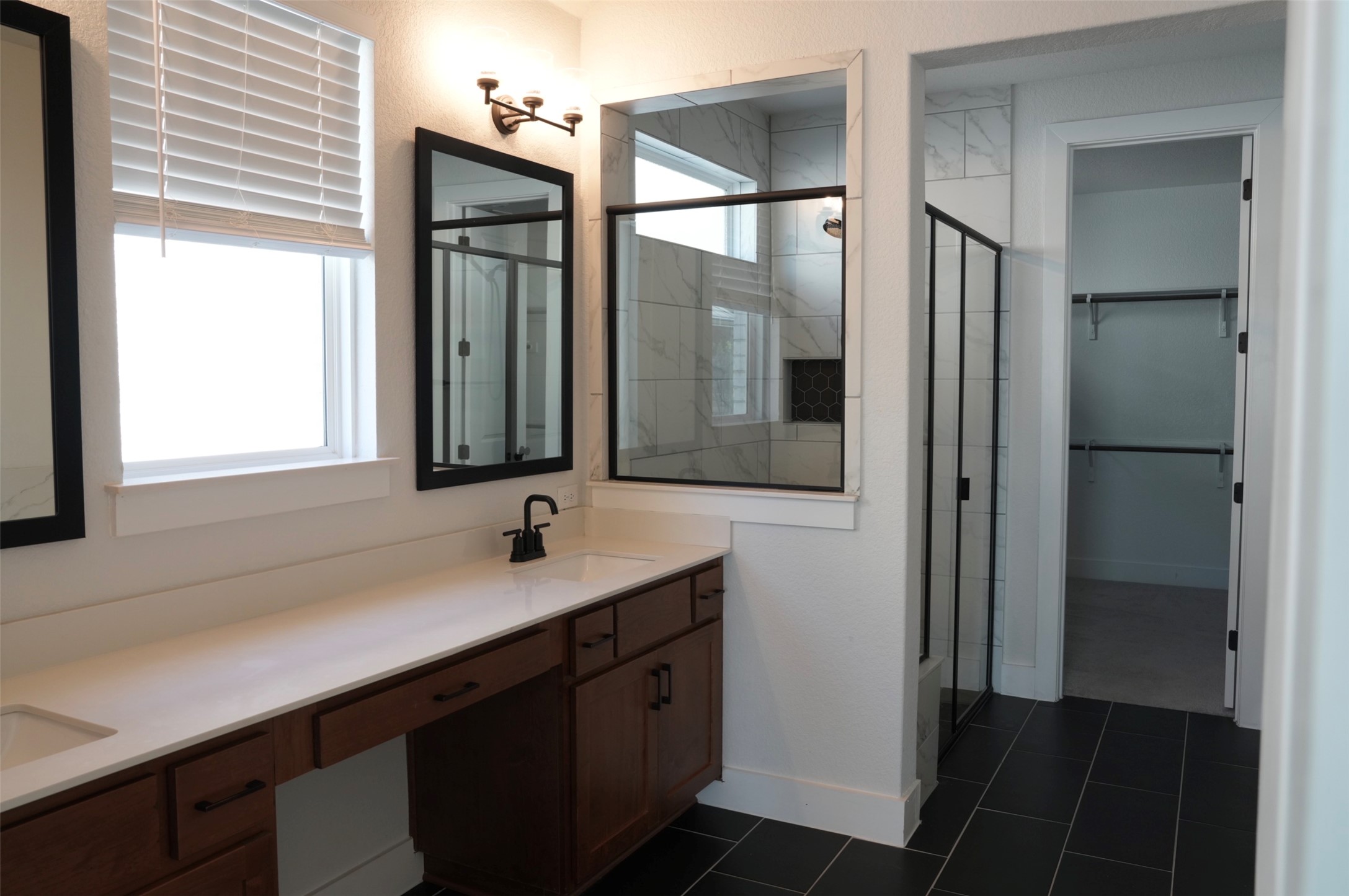 3812 Mercer Road Georgetown, TX 78628 - Photo 14 of 33 Full bathroom with a stall shower, double vanity, and a walk in closet