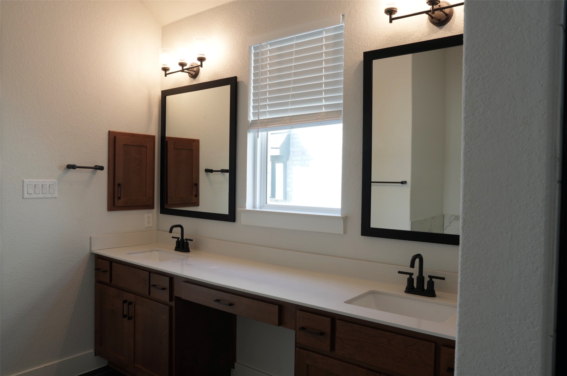 3812 Mercer Road Georgetown, TX 78628 - Photo 15 of 33 Bathroom featuring double vanity and a textured wall
