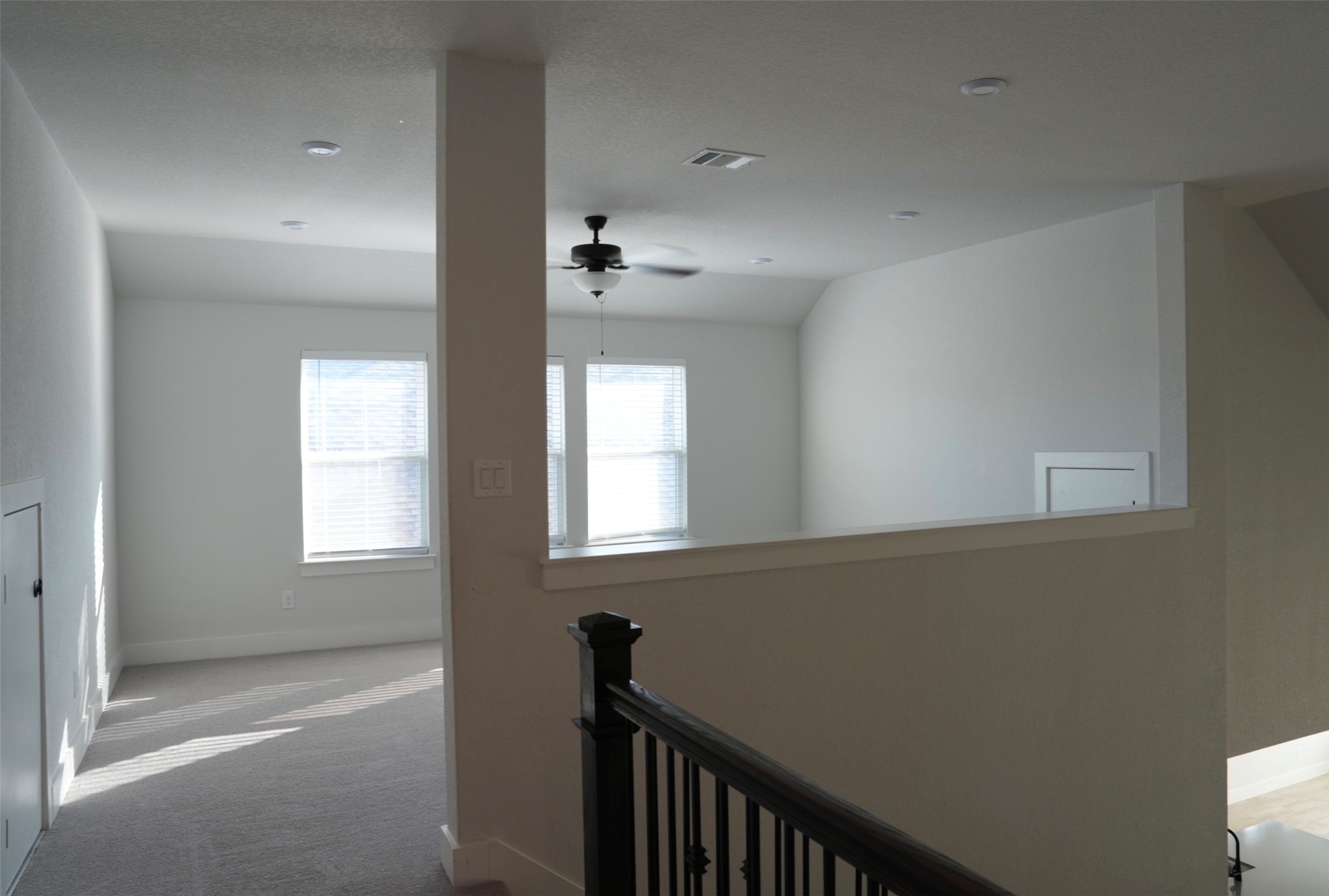 3812 Mercer Road Georgetown, TX 78628 - Photo 20 of 33 Hallway with an upstairs landing and carpet