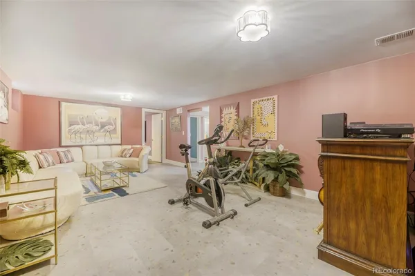 a view of a livingroom with furniture and a window