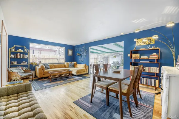 a bedroom with furniture and a wooden floor