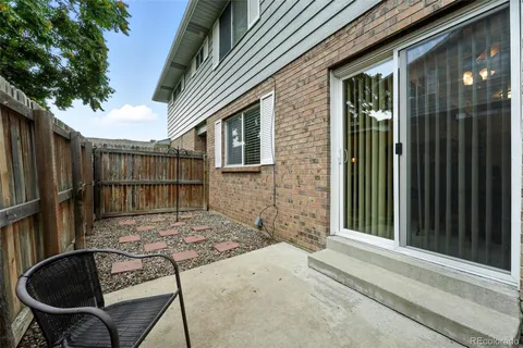 a view of backyard with tub and entertaining space