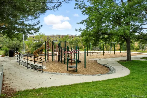 a view of a park with swings and slides