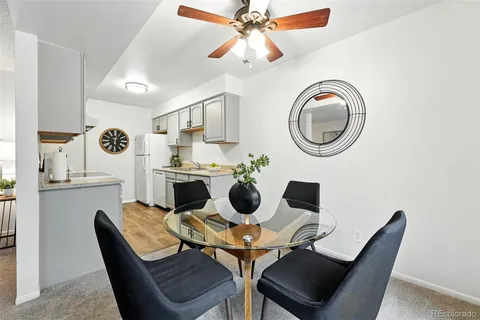 a dining room with furniture and chandelier