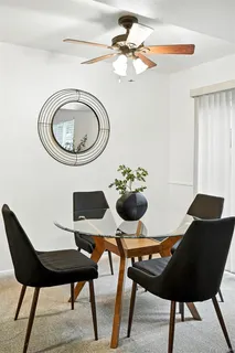 a view of a dining room with furniture and wooden floor