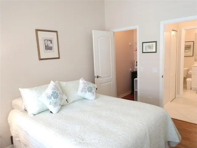 a large white bed in a white room