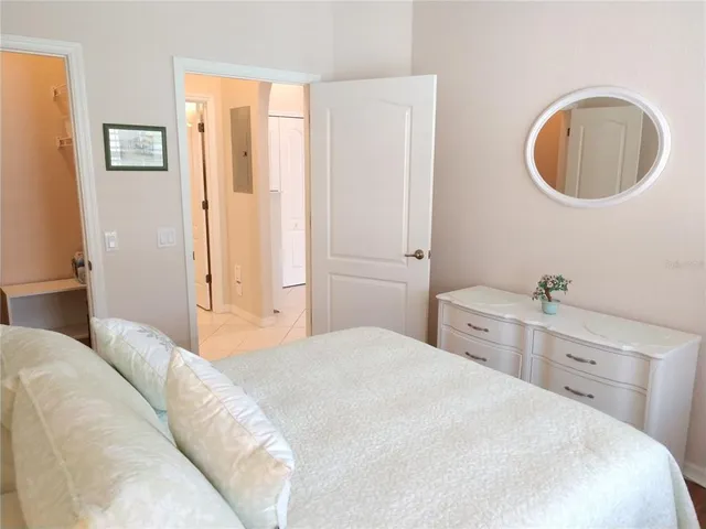 a bedroom with a bed and a closet