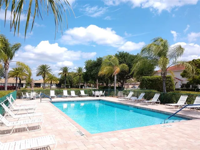 a view of a swimming pool with a patio