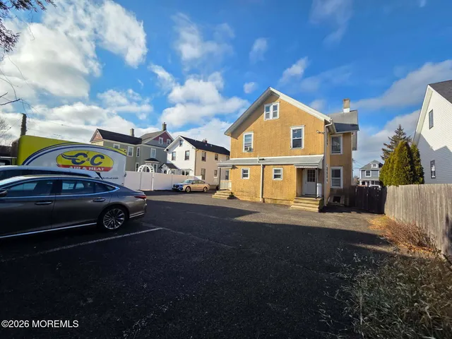 a car parked in front of a house