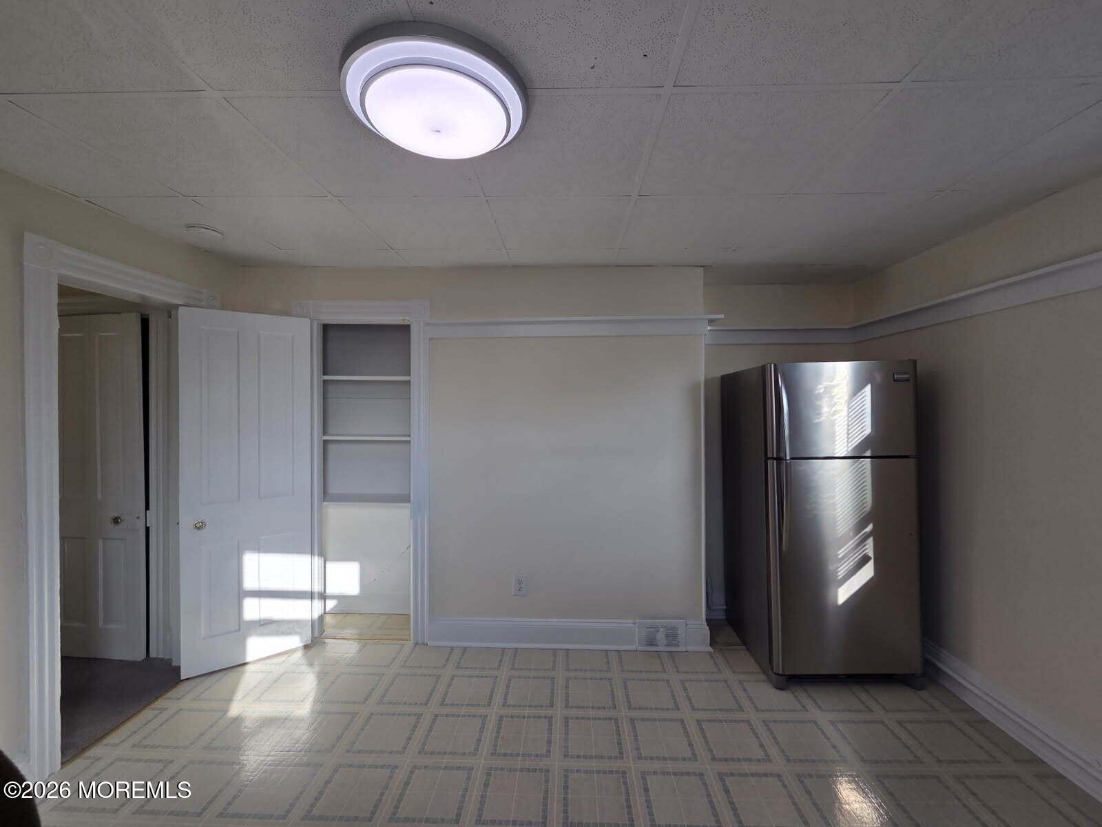 24 Rector Place, Unit 24B Red Bank, NJ 07701 - Photo 2 of 17 a view of an empty room with a window