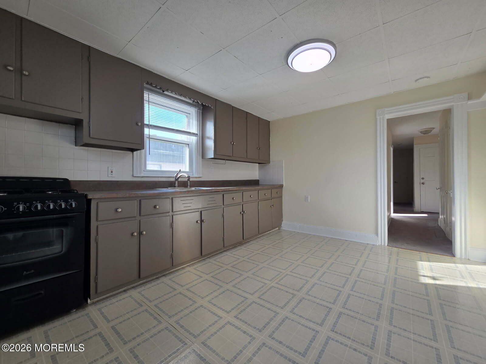 24 Rector Place, Unit 24B Red Bank, NJ 07701 - Photo 3 of 17 a kitchen with a cabinets and a stove top oven