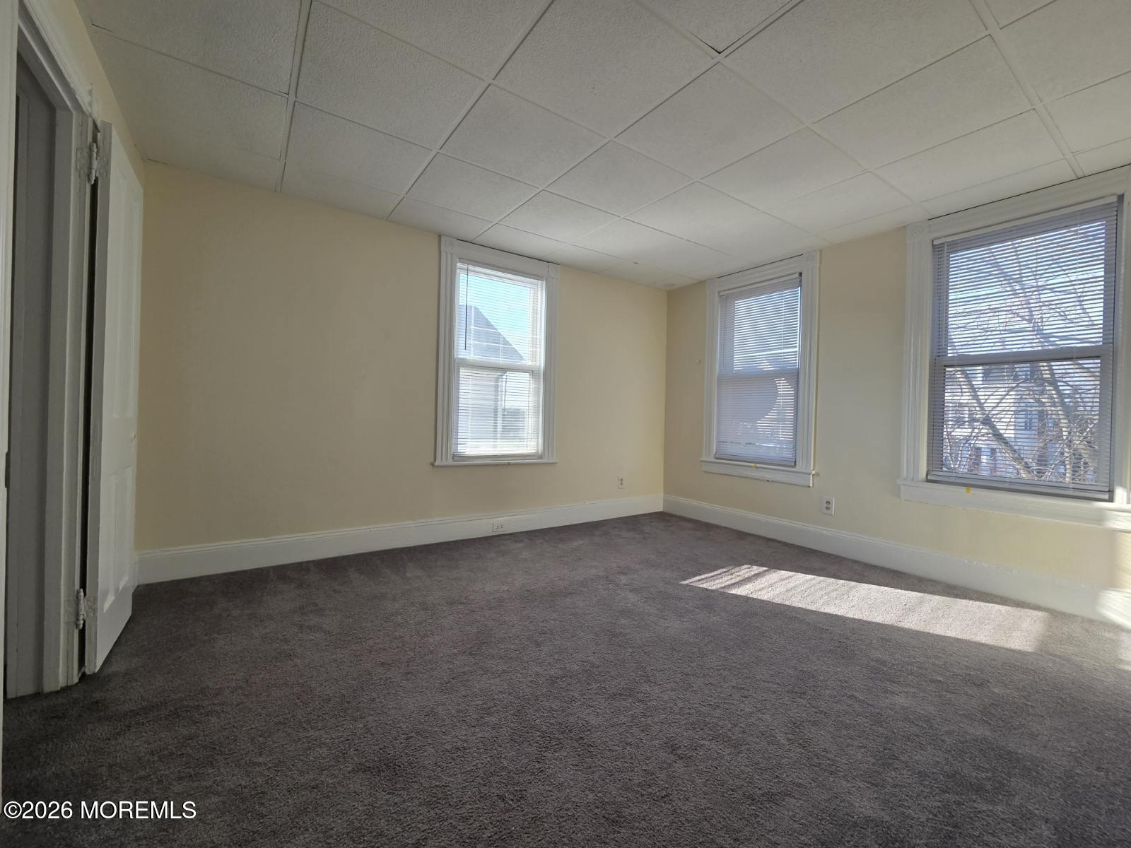 24 Rector Place, Unit 24B Red Bank, NJ 07701 - Photo 9 of 17 an empty room with windows