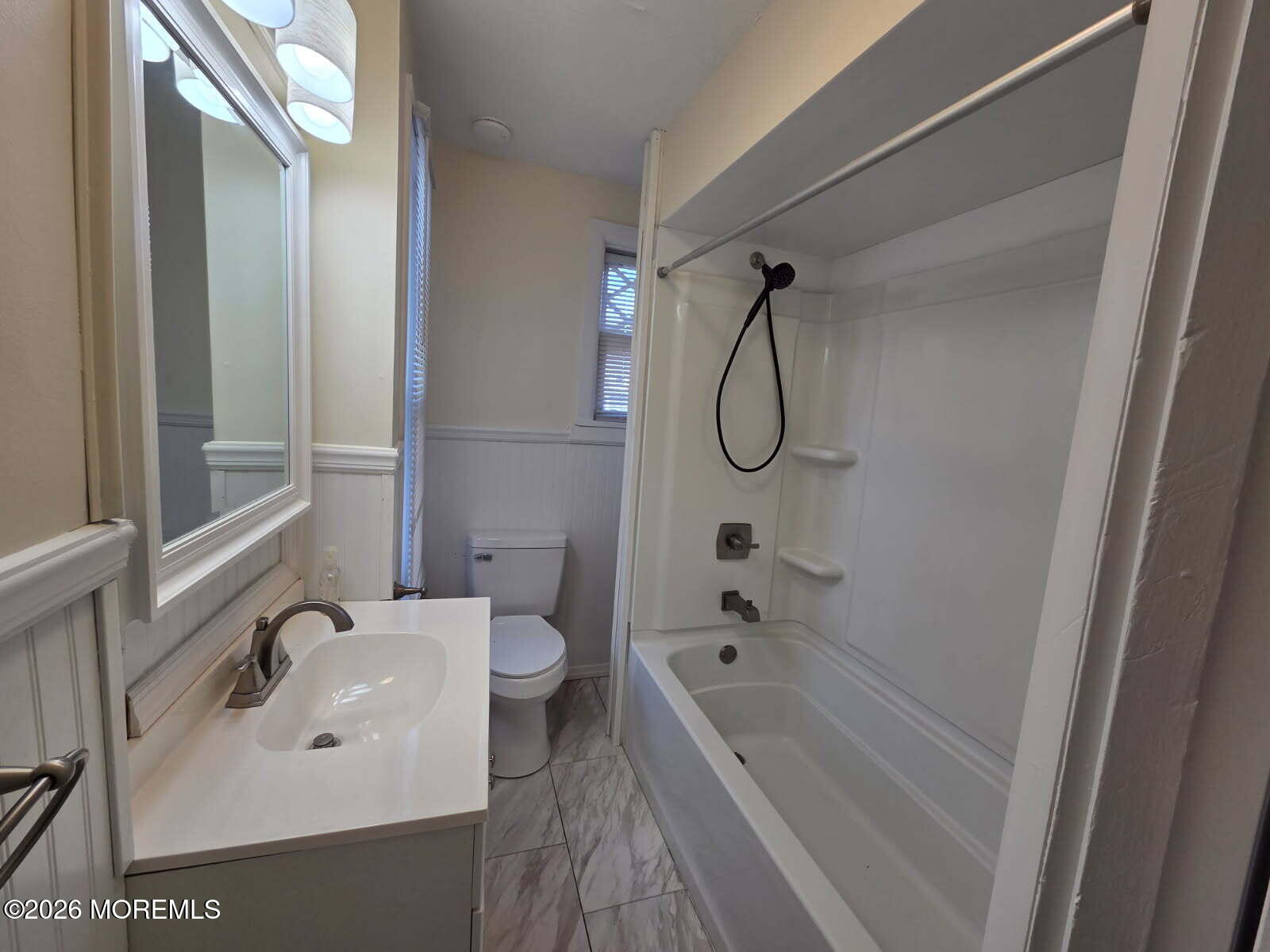 24 Rector Place, Unit 24B Red Bank, NJ 07701 - Photo 10 of 17 a bathroom with a sink a toilet and shower