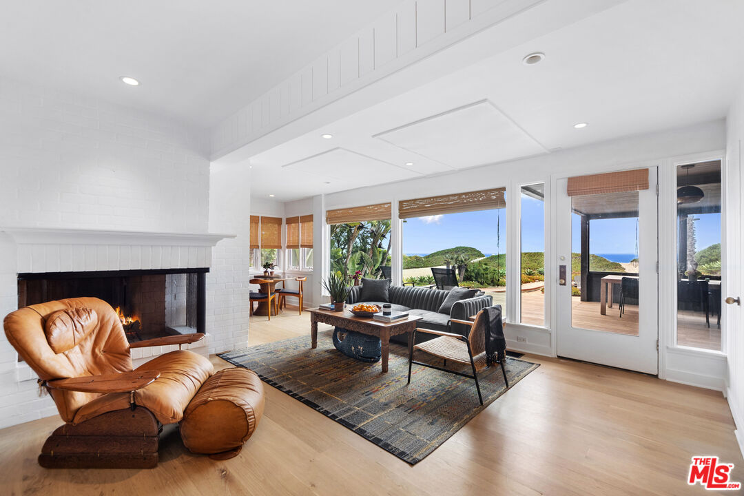 31008 Broad Beach Road Malibu, CA 90265 - Photo 19 of 41 a living room with furniture fireplace and a large window