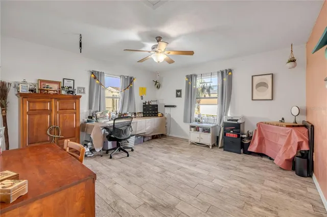 a living room with furniture gym equipment and a window