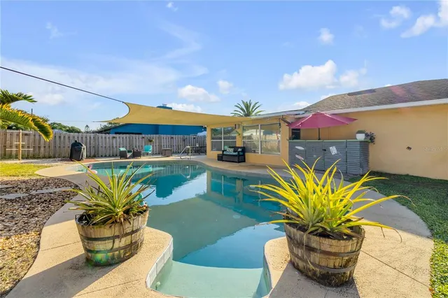 a view of a swimming pool with a patio