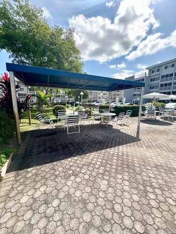 a view of a patio with wooden floor