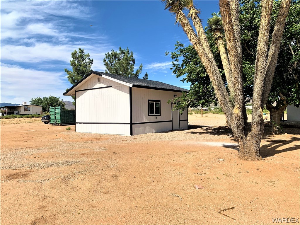 655 South Arivaca Road Golden Valley, AZ 86413 - Photo 5 of 29 a view of a house with a snow in the yard