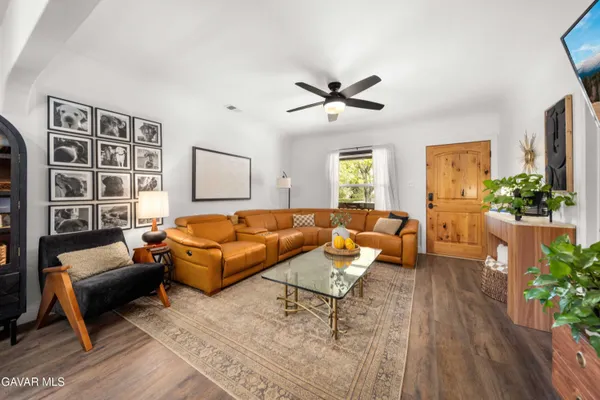 a living room with furniture and a large window